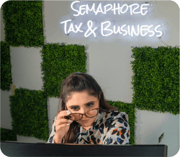 woman at desk at semaphore tax & business devision